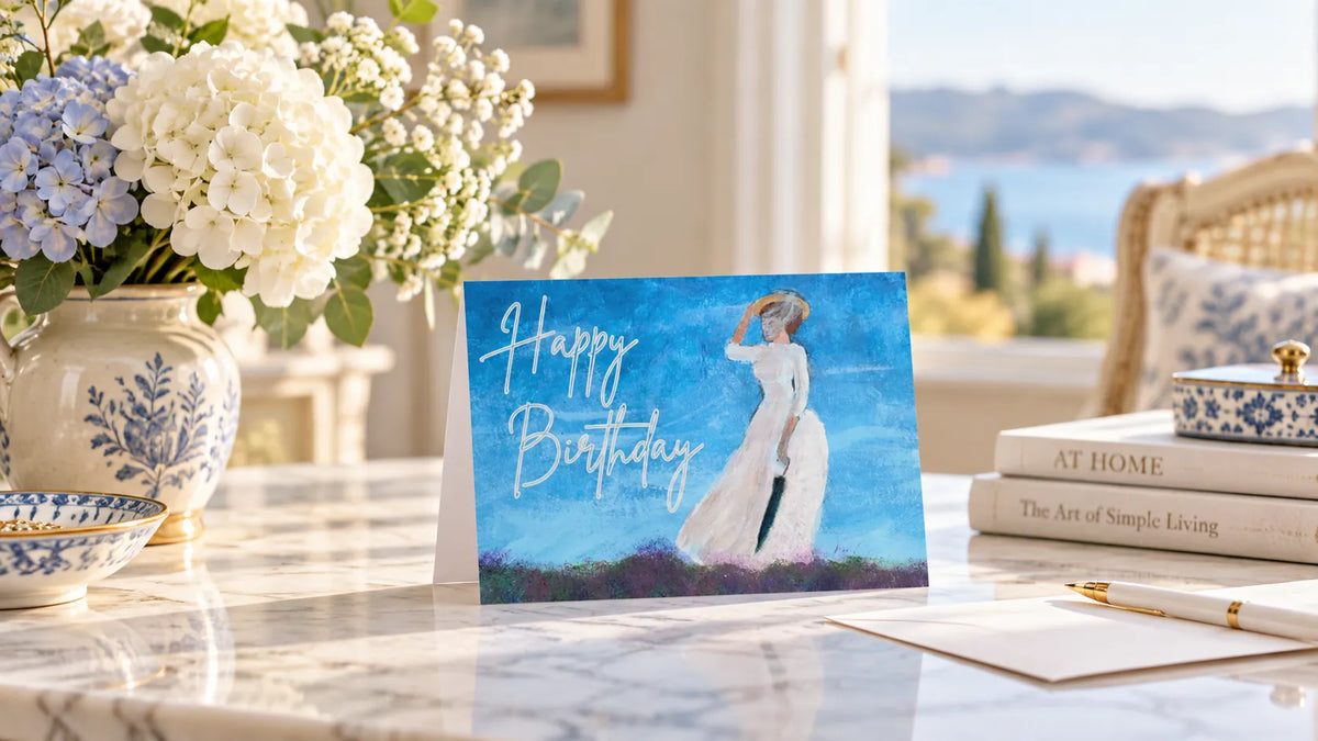 Birthday card beside flowers and a wrapped gift